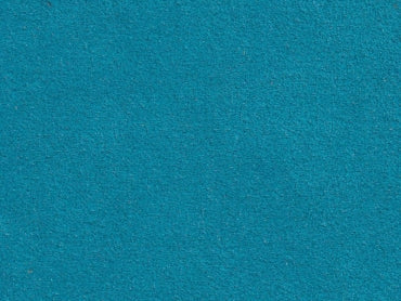 a close up of a blue carpet with a white background