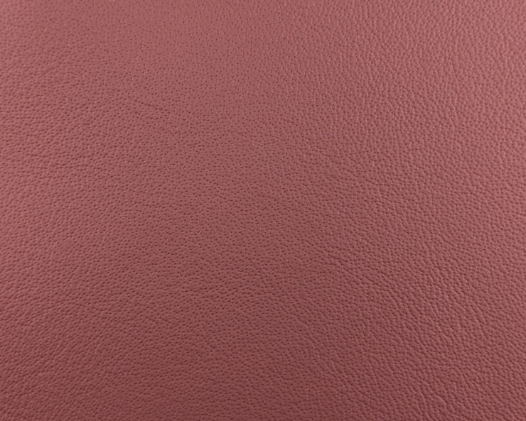 a close up of a pink leather texture