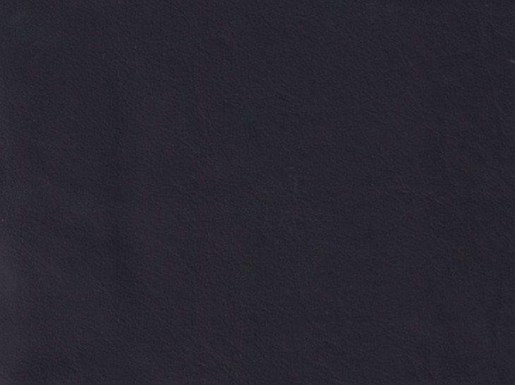 The image is a dark, textured surface with a uniform color, resembling a piece of fabric or a piece of paper.