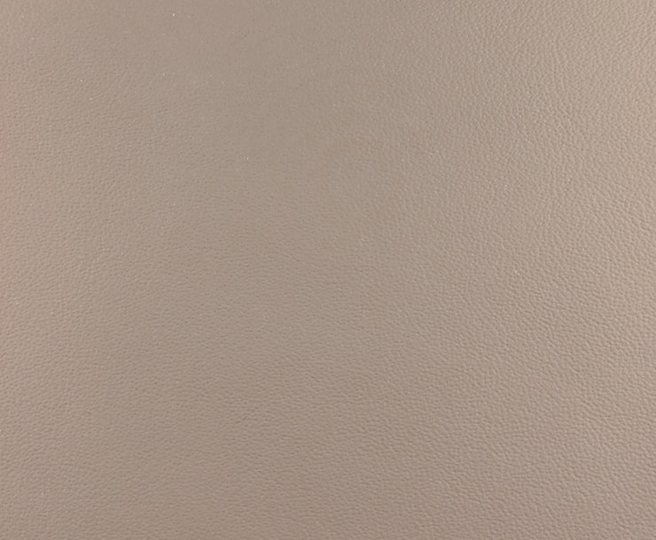 a close up view of a tan leather surface