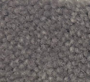 a close up view of a gray carpet