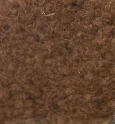 a close up of a pile of brown wool