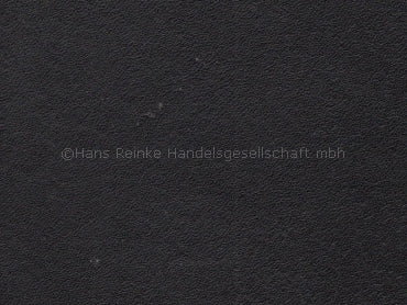 a close up of a black surface with a white border